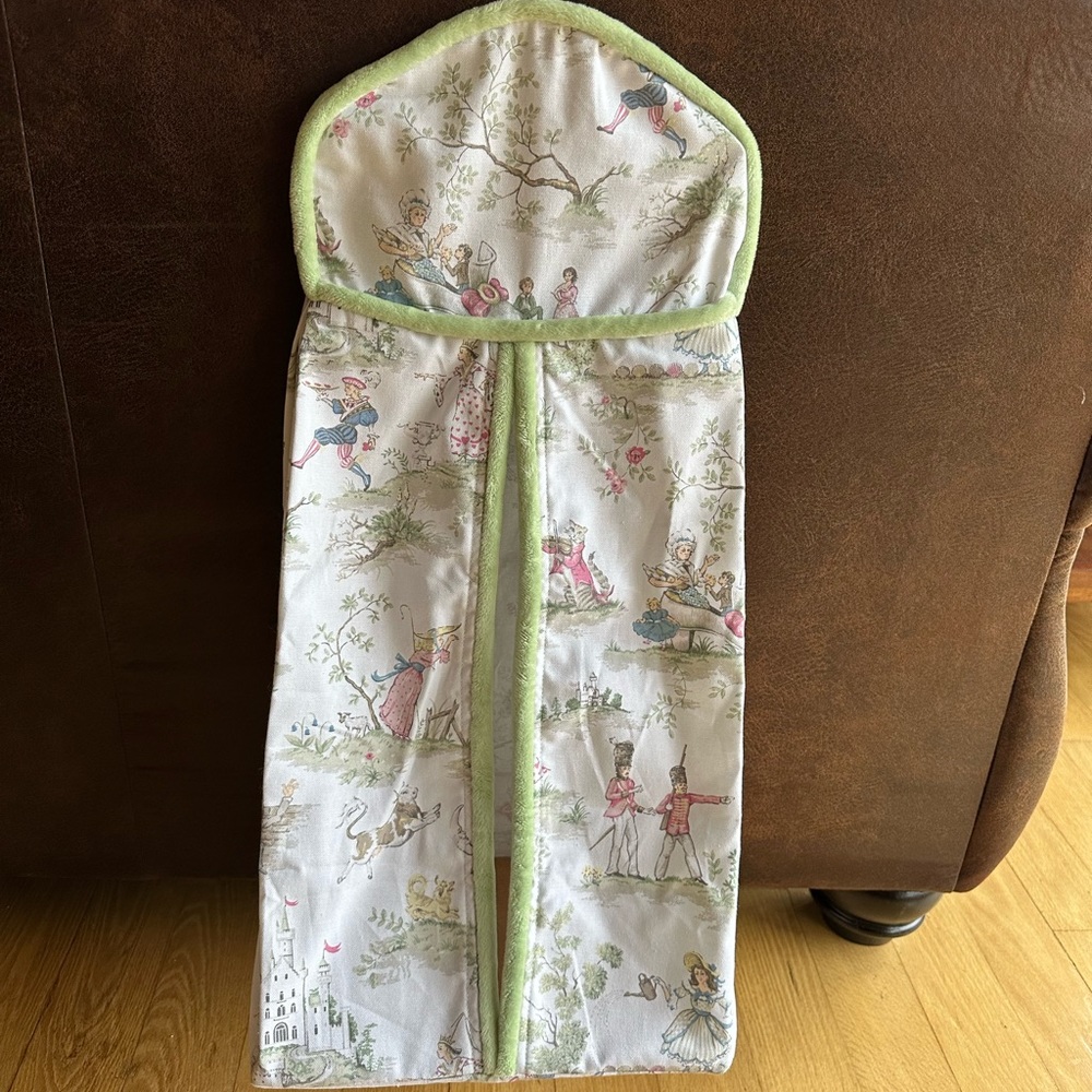 Diaper holder and crib rail cover.